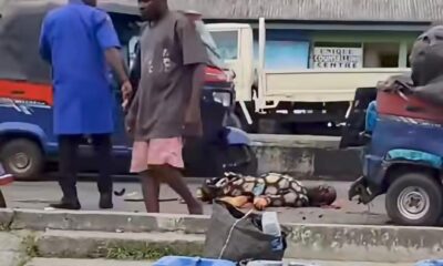 FRSC officers and residents gather after a cement-laden trailer crashed into a commercial tricycle, killing a keke driver in Yenagoa, Bayelsa State.